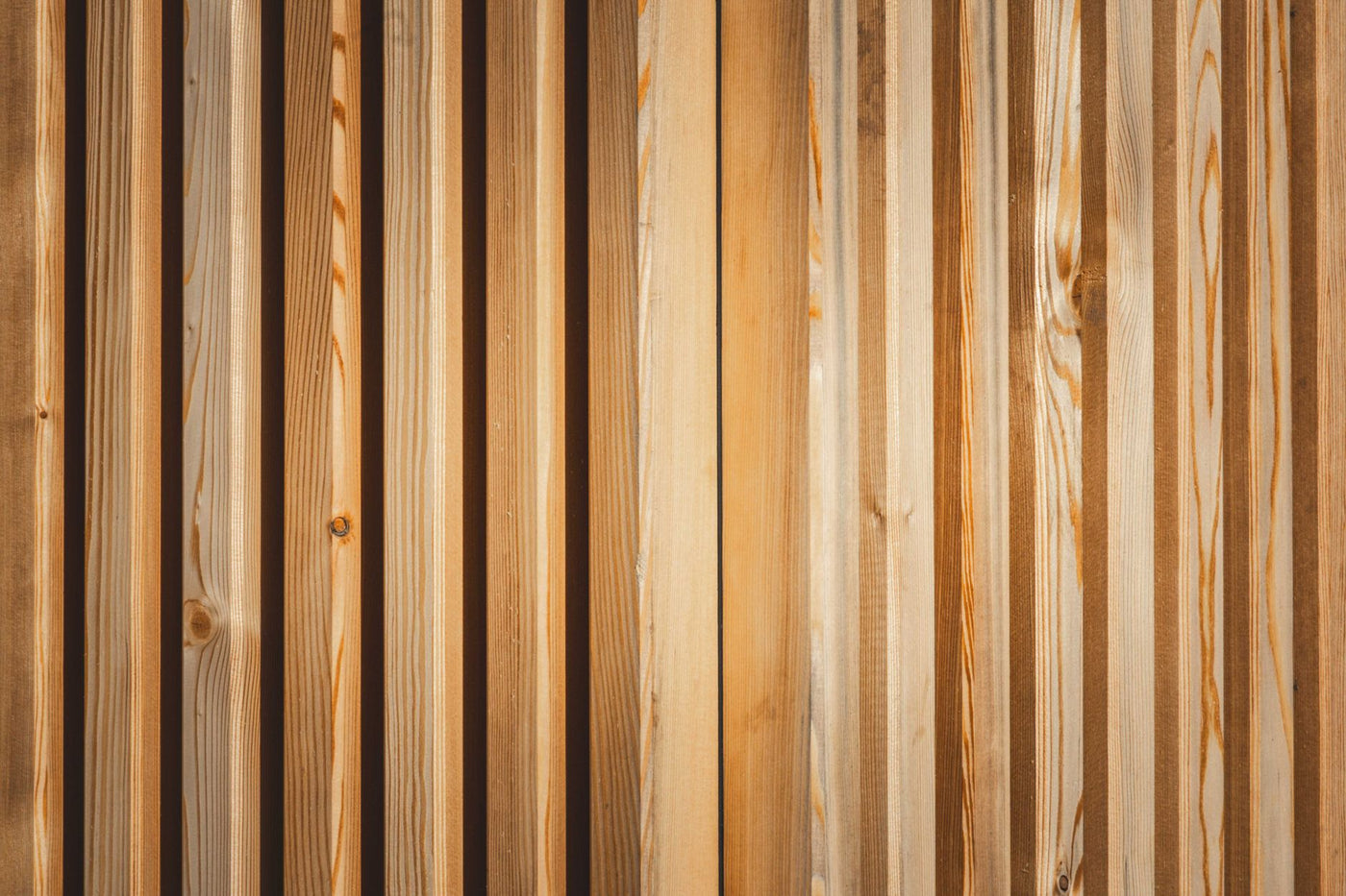 A detailed view of a wooden panel with natural texture and pattern, showcasing the beauty of wood grain.